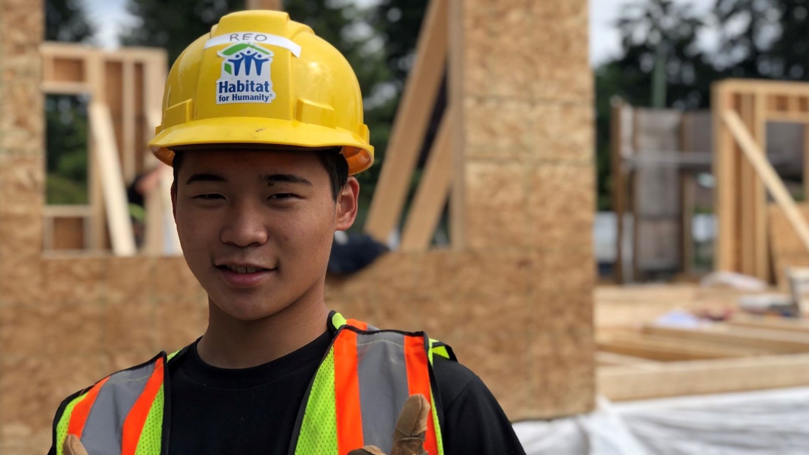 International student Reo on a Habitat for Humanity job site.